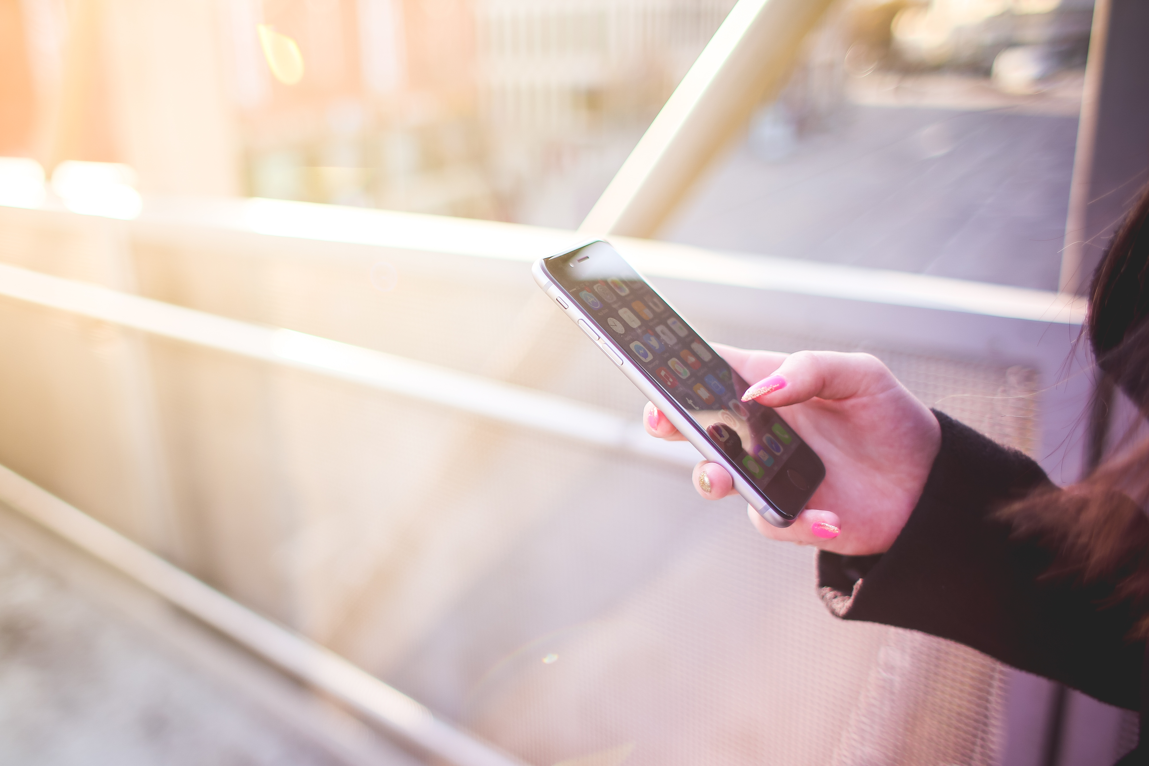 Young Woman Holding Iphone In Her Right Hand Picjumbo Com