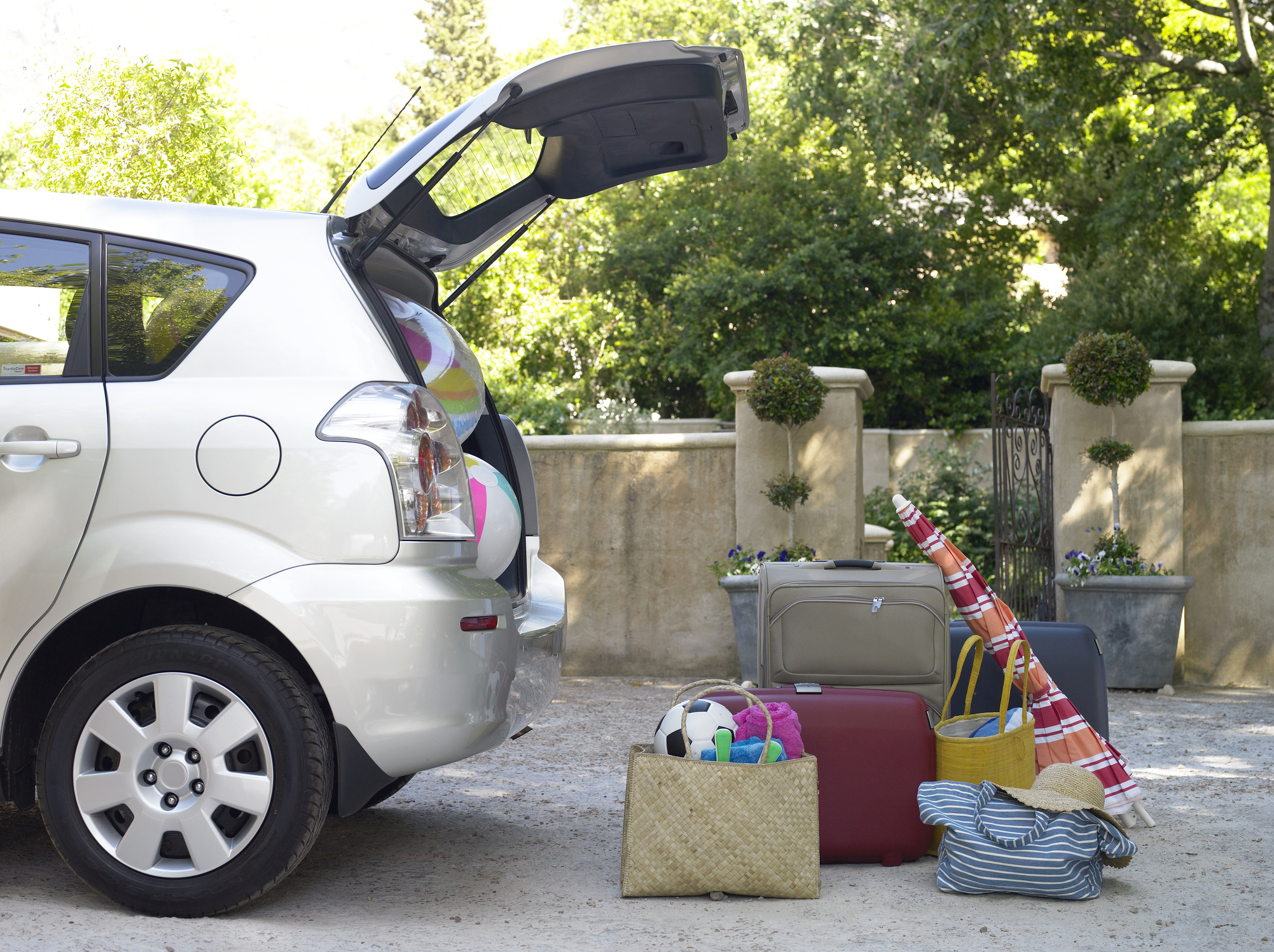 Car With Boot Open And Beach Equipment And Cases