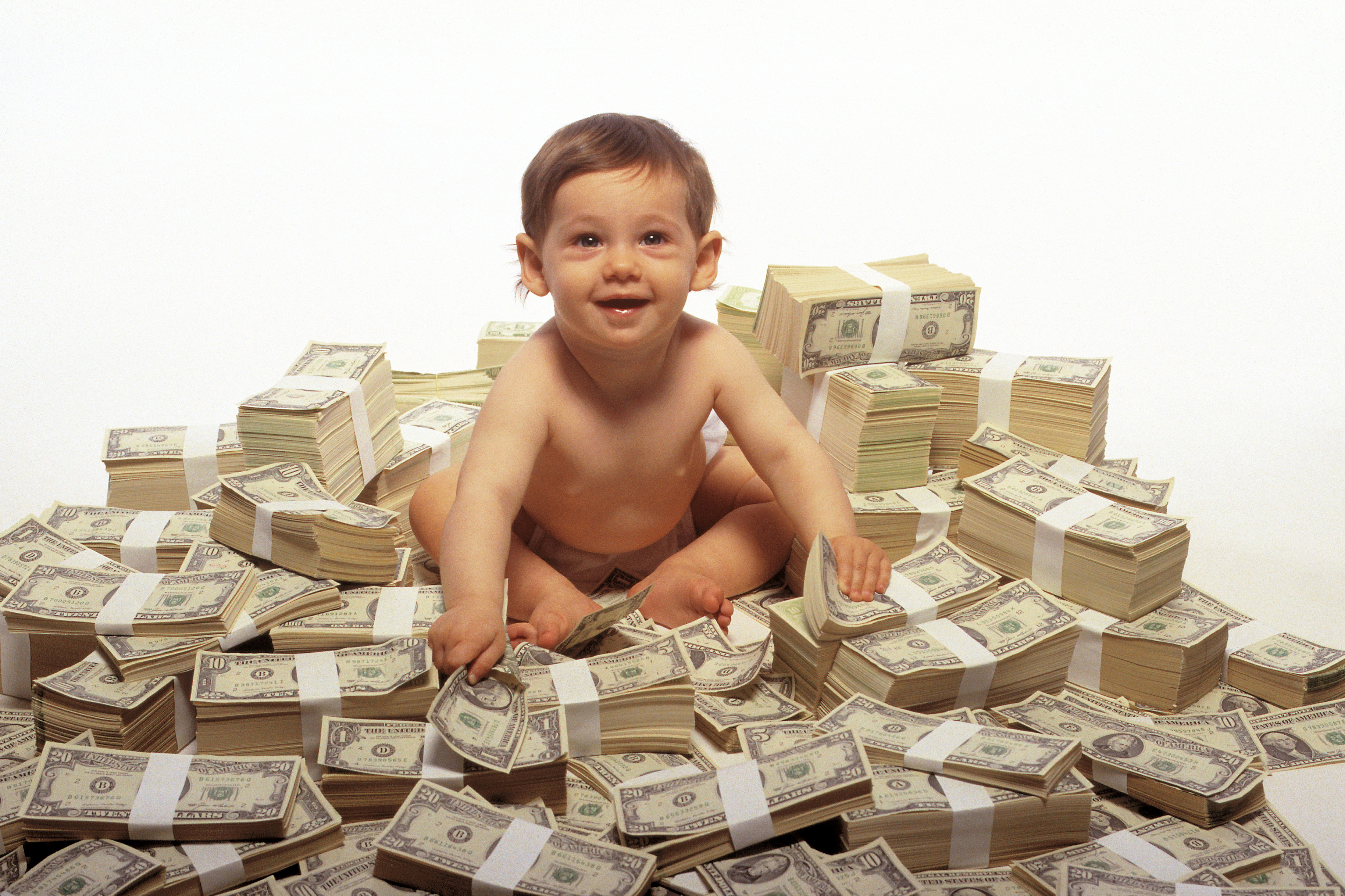 Baby Sitting On Pile Of Money