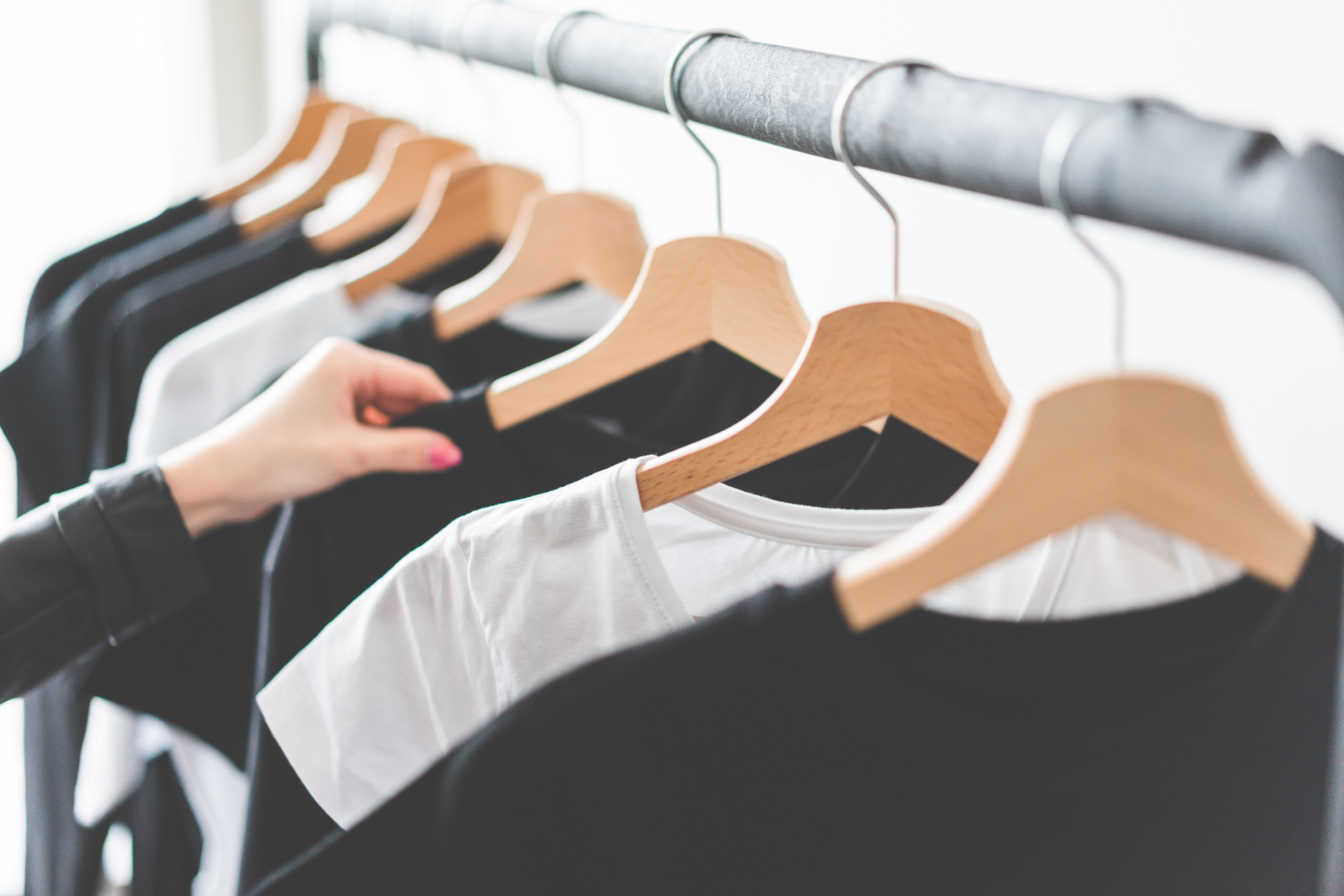 Woman Choosing T Shirts During Clothing Shopping At Apparel Store 2 Picjumbo Com