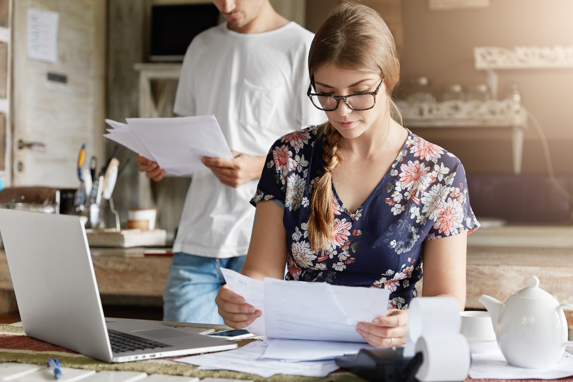 Beautiful Woman Reads Documents Attentively, Prepares Financial Report, Calculates Figures And Works On Generic Portable Laptop Computer. Family Couple Mange Budget, Plan To Buy Something Expensive; Shutterstock ID 1022177242; CUID: 030250; Organization Name: Fort Worth Community CU; Usage (Sales, Marketing, Internal, Other): Marketing